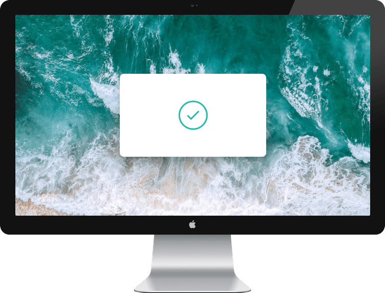 macbook with green checkmark on the center of a screen